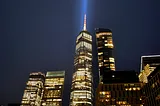 The light from the Freedom Tower down at Ground Zero in NYC