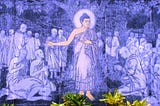 Purple-fluorescent wall painting of ‘The Buddha preaching The Dhamma’ at Dhamma Igatpuri