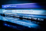 A stack of Paul McCartney albums from various decades