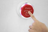 Finger pressing red button