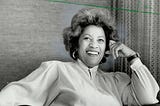 Black and white photo of Toni Morrison smiling.