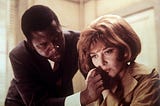 Sidney Poitier comforting a distraught Lee Grant in a scene of In the Heat of the Night