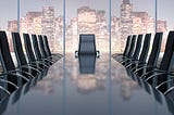 Empty board room focusing on the chair at the top of the table (namely, you).