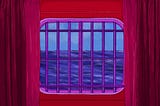 Illustration of a cabin window on a cruise ship, looking out at the ocean. The window has bars over it.