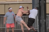 the iconic motgoemry bralw picture of rhe hat being throwm racists, humor,