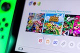 A photo of a Nintendo Switch menu. “Animal Crossing: New Horizons” is highlighted.