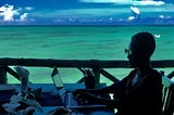 Photo of the author working on her laptop aloft the Indian Ocean.