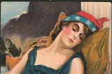 Picture of a woman sleeping. She’s wearing a headband and clothing that suggests the American flag.