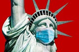 A close up of the Statue of Liberty wearing a surgical mask.