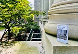 Marketing Poster on the steps of Langdell Library at Harvard Law School — T