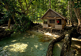 Wooden cabin at the end of Milne Bay, Papua New Guinea