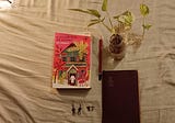 A diary, a book, a tattoo and a leaf