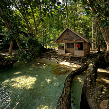 Wooden cabin at the end of Milne Bay, Papua New Guinea