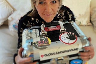 Nina Pearse holds a collector’s item record case with vinyl dance records for sale