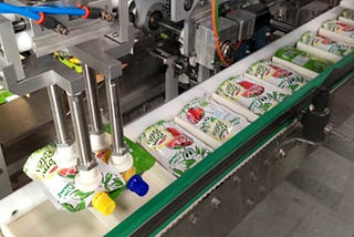 Robotics in Secondary Packaging Systems for the Food Industry