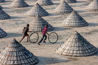 Image of a two boys rolling hoops