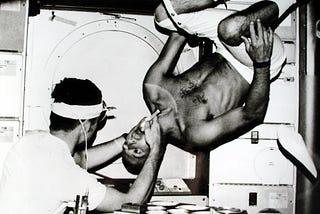 Pete Conrad having a weightless dental check-up, 1973