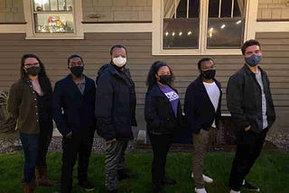 The entire NSBE Pro-PDX team of interns, Danielle Thompson and Eric Stratton, and four board members stand together in row with masks on.