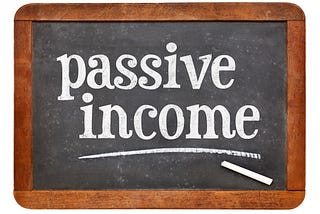 passive income sign - white chalk text on a vintage slate blackboard