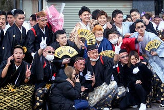 A group of young Japanese adults celebrating seijin no hi in haori and hakama.