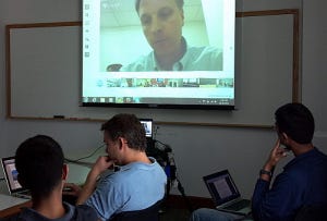 Haas MBAs sit in a global video conference training hosted by Bridges Ventures