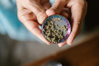 marijuana grinder in hands