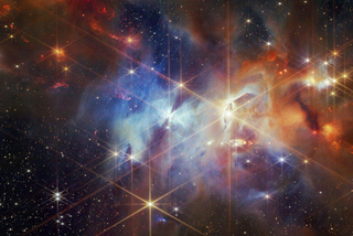 Small points of light are sprinkled across the field; the brightest sources in the field have the eight-pointed diffraction spikes that are characteristic of the James Webb Space Telescope. Credit: NASA, ESA, CSA, STScI, K. Pontoppidan (NASA’s Jet Propulsion Laboratory), J. Green (Space Telescope Science Institute)