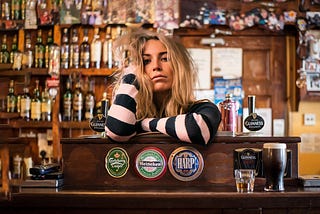 A female bartender poses