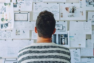 Man looking at print papers