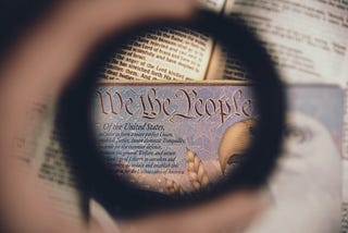 “We the People…” Bible in the background