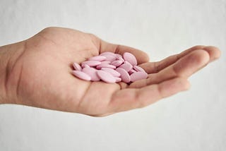 An antiviral pill that cuts the risk of hospitalization or death from Covid by half — trials show