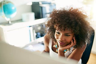 A woman working intently at her desk