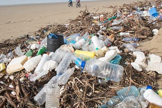 Plastic waste piled up on a beach.