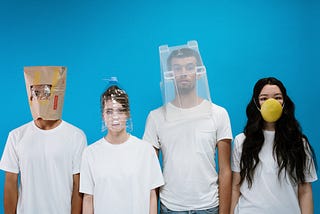 Four people with different, creative face mask solutions.
