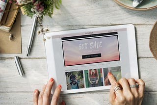 Beautiful workplace table and tablet flat lay