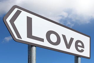 Road sign with LOVE text