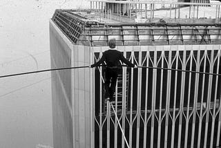 Philippe Petit tightrope walking between World Trade Center towers, 1974