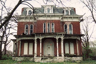 Old abandoned brick building with white moulding