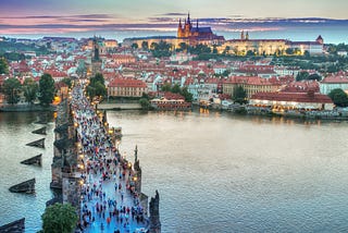 The old Charles bridge and in the background the Prague Castle and Cathedral.
