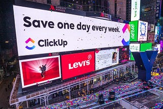 ClickUp Banner on a building — Save one day every week