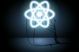 An LED React symbol attached to wires leading out of the photo