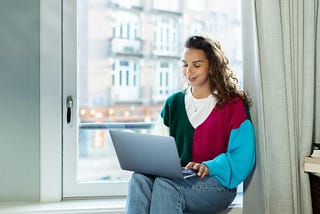 Relaxed woman working from her home.