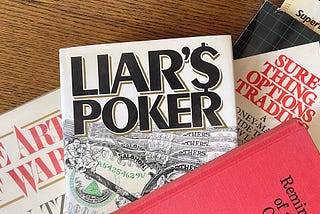 The writer’s desk, covered bith books, Liar’s Poker on top. Interview with Annie Logue on Native Angelino Podcast — Tom Levine host, Los Angeles, CA