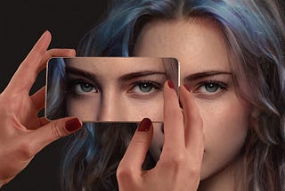 Girl looking through a mirror