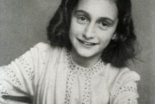 Portrait photograph of Anne Frank as a young girl