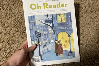 hand holding issue 014 of Oh Reader magazine