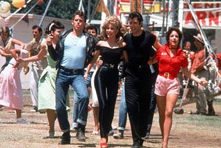 The Cast of ‘Grease’s’ Combined Net Worth Is Over $300 Million