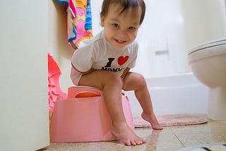 baby is being trained for potty