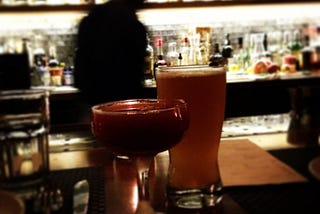 Glasses of beer and booze on a bar