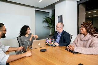 A group of people from different backgrounds working together.